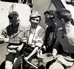 Alongside: No 2 Commando drinking tea with a Yugoslav partisan