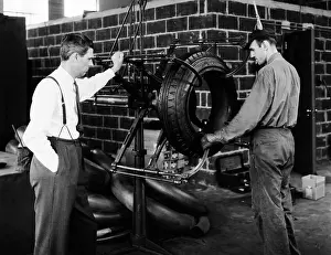 Tread: 2 Men with Rubber Tire Machine Management Type Man in Suit