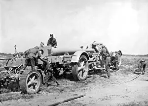 Inserted: 21cm mortar is made ready to fire