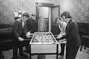 Wilmslow: 4 young men playing table football, Birch Villa pub
