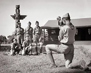 Thrifty: 5 Boys at Camp Posing under Totem Pole Having