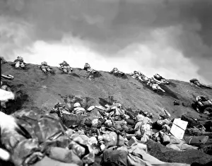Suribachi: 5th Division Marines crawl up a slope on Red Beach