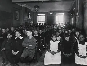 Assimilation: About 75 children packed into a NYC classroom