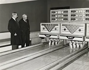 Humourist: A. P. Herbert, examining a modern skittles game with automatic scoring system