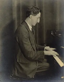 Humourist: A. P. Herbert playing the piano