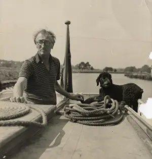 Steering: A. P. Herbert steering a riverboat