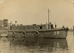 Steering: A. P. Herbert steering a riverboat