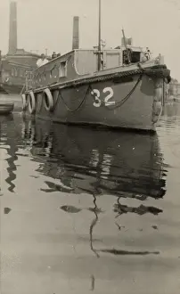 Steering: A. P. Herbert steering a riverboat