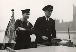 Steering: A. P. Herbert steering a riverboat on the River Thames