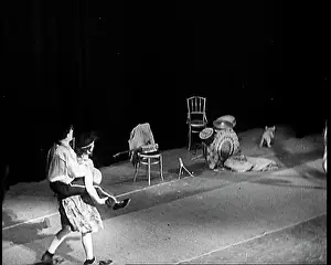Acrobats: Acrobats Performing In Front of An Audience in a Theatre