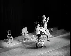Acrobats: Acrobats Performing In Front of An Audience in a Theatre