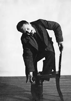 Pained: Actor with his foot through a chair