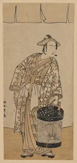 Ichikawa: The actor Ichikawa Monnosuke II holding a box lantern