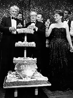Marais: Actor Jean Marais cutting the cake at a party