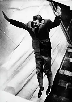 Marais: Actor Jean Marais jumping in the air