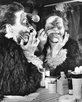 Freda: Actress Freda Wyn doing cat makeup for a pantomime
