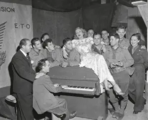 German American: Actress Marlene Dietrich singing for a group of