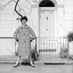 Advertisement for Burberry overcoats
