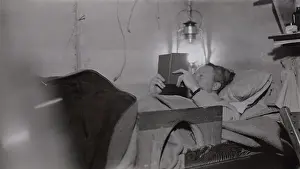 Lcgr1802: Admiral Richard Byrd reading by lantern light