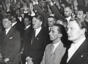 Staying: Adolf Hitler (3rd from right) in civil at a rally