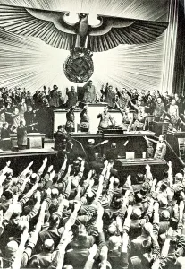 Addressing: Adolf Hitler addressing a meeting in the Reichstag