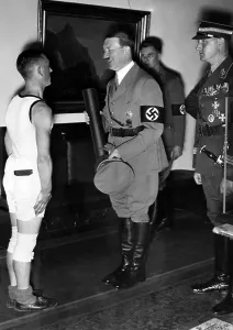 Congratulate: Adolf Hitler congratulates an athlete, 1935