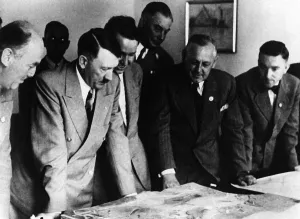 Brueckner: Adolf Hitler with construction plans for Bayreuth, 1939