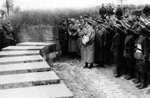 Followers: Adolf Hitler with his followers at the cemetery
