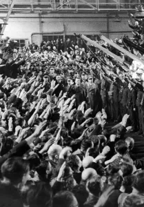 Followers: Adolf Hitler and his followers marching into an armoury