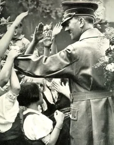Greets: Adolf Hitler greets crowd during a visit to a