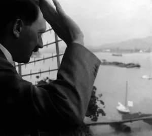 Salutes: Adolf Hitler greets from the hotel window, 1934