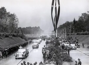 Inaugurates: Adolf Hitler inaugurates a ssegment of the Autobahn