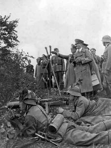 Explains: Adolf Hitler inspects a maneuver 1937