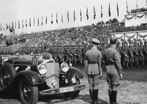 Tribune: Adolf Hitler at the march of the RAD at the
