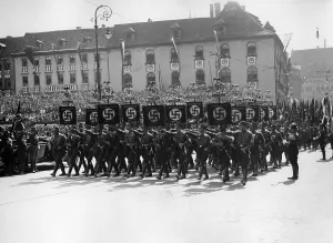 Standards: Adolf Hitler at the march of the SA standard