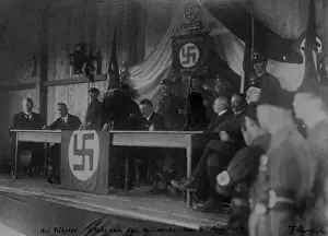 Siding: Adolf Hitler with members of the NSDAP sitting