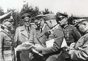 Fuhrer: Adolf Hitler, with officers, study maps during the