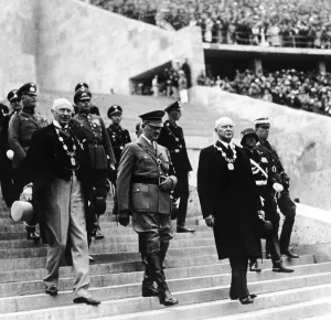 Enters: Adolf Hitler opens the Olympic Summer Games in Berlin, 1