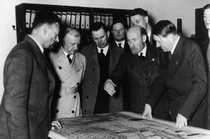 Bruckmann: Adolf Hitler with plans for a reconstruction of the Deu
