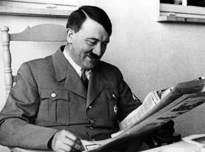 Staying: Adolf Hitler reading the newspaper, 1935