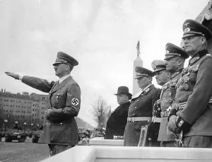 Salutes: Adolf Hitler salutes marching troops, Berlin