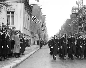 Salutes: Adolf Hitler salutes marching troops, Berlin