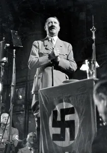 Links: Adolf Hitler during his speech at the party's founding