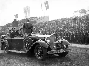 Zeppelinfeld: Adolf Hitler standing in car on arrival in Nuremberg