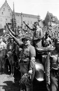 Gregor: Adolf Hitler (standing in the car ) greets parading
