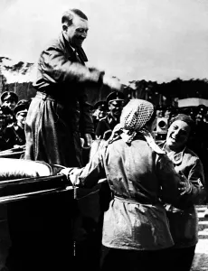 Convertible: Adolf Hitler with women in work clothes, 1935
