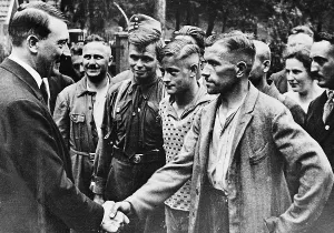 Seeks: Adolf Hitler with workers, 1934