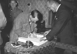Writes: Adolf Hitler writes in Golden Book of Munich after speech
