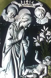 Kneels: The Adoration'. Virgin Mary, hands in position
