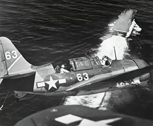 Lcgr1310: Aerial view of a Curtiss Helldiver in the landing
